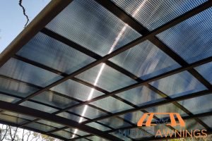 Transparent vs. Tinted Polycarbonate Roofs in Singapore: Which Option Suits Your Home? 4 tinted-polycarbonate-roofs-transparent-vs-tinted-polycarbonate-roofs-in-singapore-which-option-suits-your-home-polycarbonate-roofing-midas-awnings-singapore