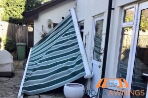 How to Choose Awnings That Are Perfect for Singapore’s Humid Climate 7 inspecting-for-damage-how-to-choose-awnings-that-are-perfect-for-singapores-humid-climate-awnings-midas-awnings-singapore