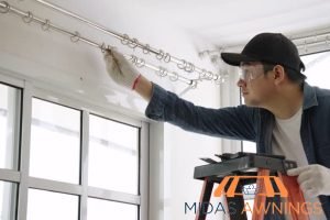 How to Choose the Right Curtain Rod Length for Any Window in Your Home 2 extend-beyond-the-window-frame-for-full-coverage-how-to-choose-the-right-curtain-rod-length-for-any-window-in-your-home-curtain-rod-installation-midas-awnings-singapore