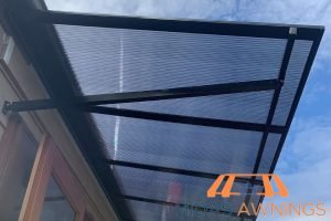 Retractable Awning Installation in Singapore - Landed, Newton 35 long-term-performance-how-polycarbonate-roofs-perform-during-heavy-rains-and-storms-in-singapore-polycarbonate-roofing-long-form-midas-awnings-singapore