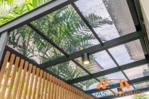 Retractable Awning Installation in Singapore - Landed, Newton 33 waterproofing-and-leak-resistance-how-polycarbonate-roofs-perform-during-heavy-rains-and-storms-in-singapore-polycarbonate-roofing-long-form-midas-awnings-singapore